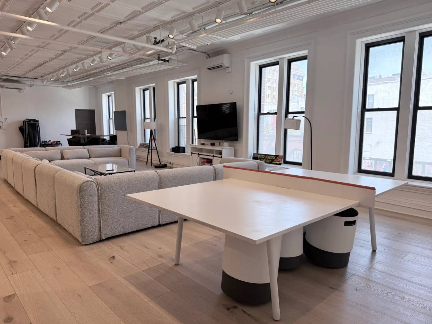 Lounge with 12-section couch and ping pong