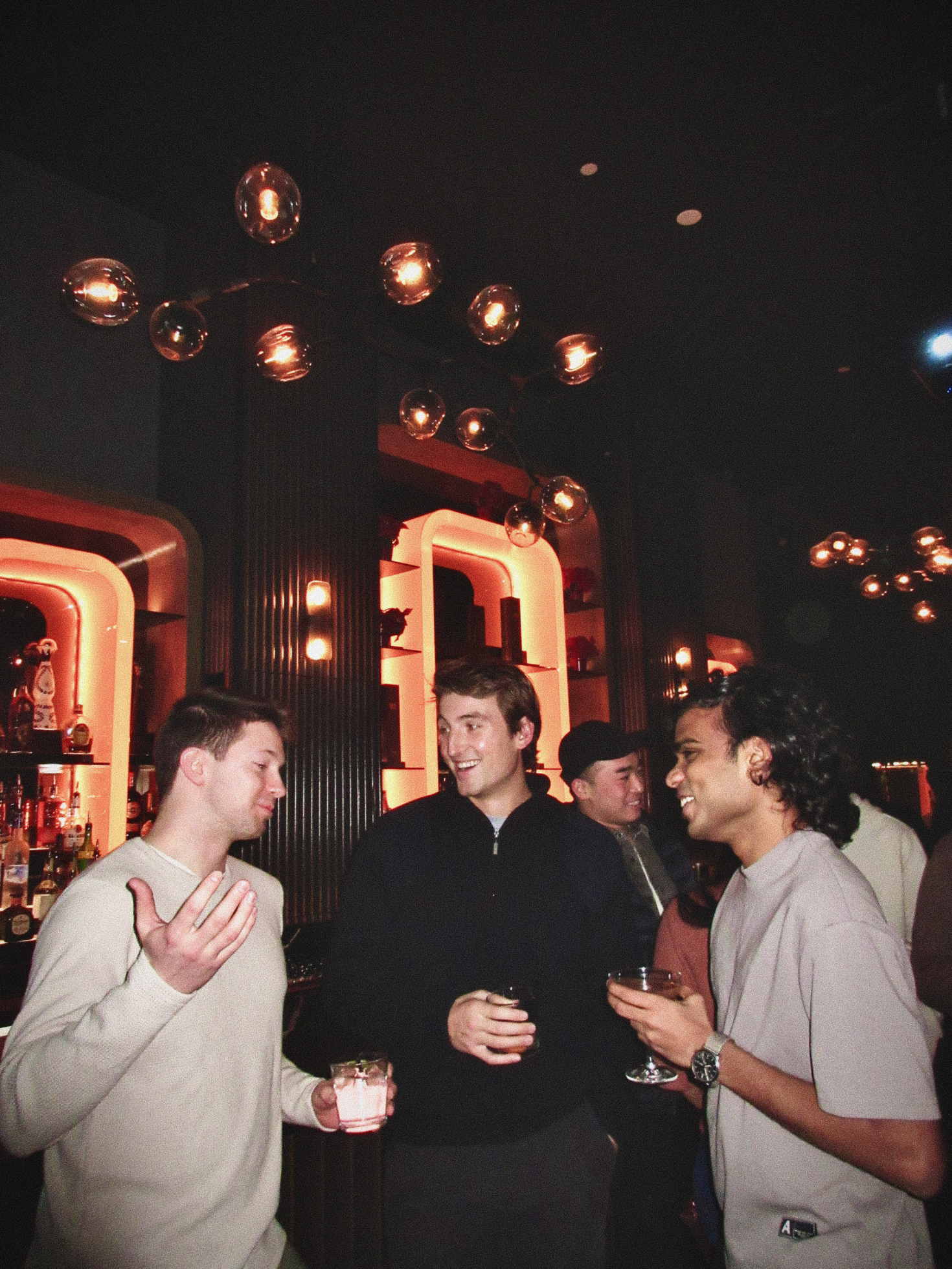 Members talking over drinks at a Consumer Club NYC mixer